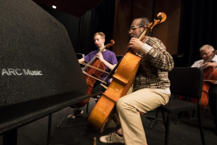 Yuriy Klyushnik and Elgin Farschman practices the cello together on Mar. 8 at American River College.(Photo by Ashley Hayes-Stone)