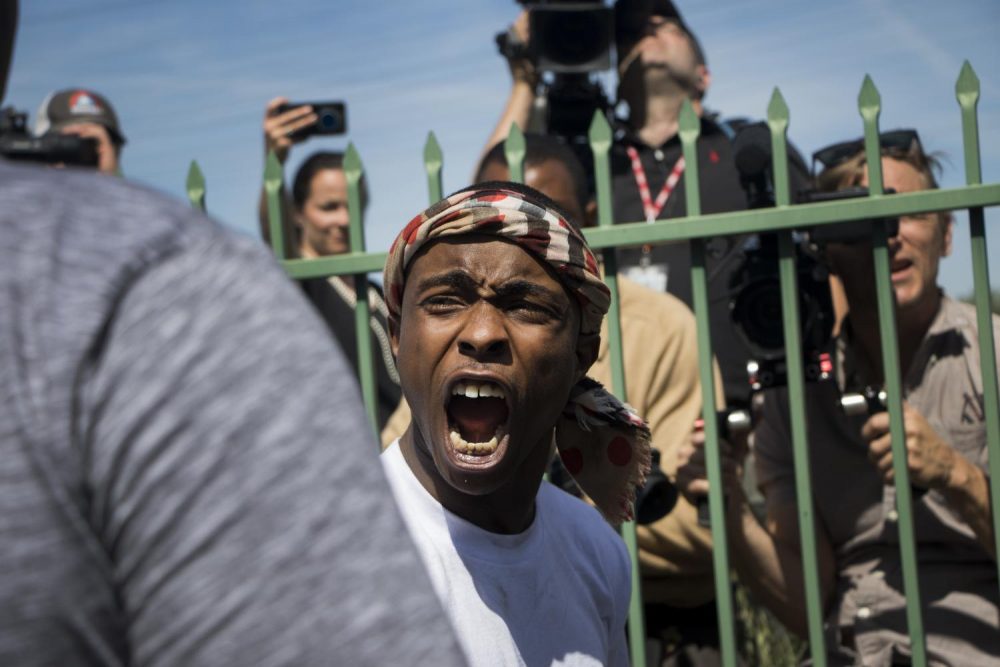 Stevante Clark yells at the media during his brother Stephon Clarks funeral at the Bayside of South Sacramento Church on March 29, 2018. (photo by Ashley Hayes-Stone)