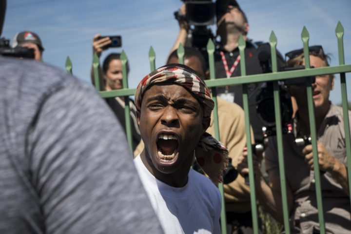 Stevante Clark yells at the media during his brother Stephon Clark’s funeral at the Bayside of South Sacramento Church on March 29, 2018. (photo by Ashley Hayes-Stone)