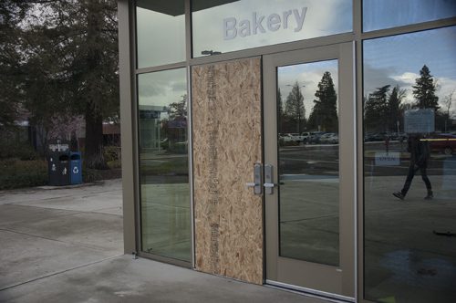 A piece of plywood covers one of the doors to the Oak Cafe on March 2 at ARC. The cafe was broken into on Feb. 24. (Photo by Brienna Edwards)