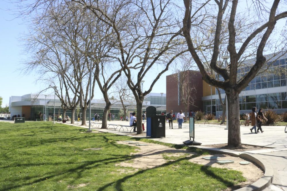 Students walk in front of the American River College library during the first day back from spring break on April 2, 2018.