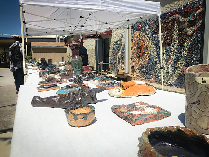 Ceramic works created by students are sold by the art department in front of ARC’s Fine & Applied Arts buildings and theater on May 8. (Photo by Hannah Yates)