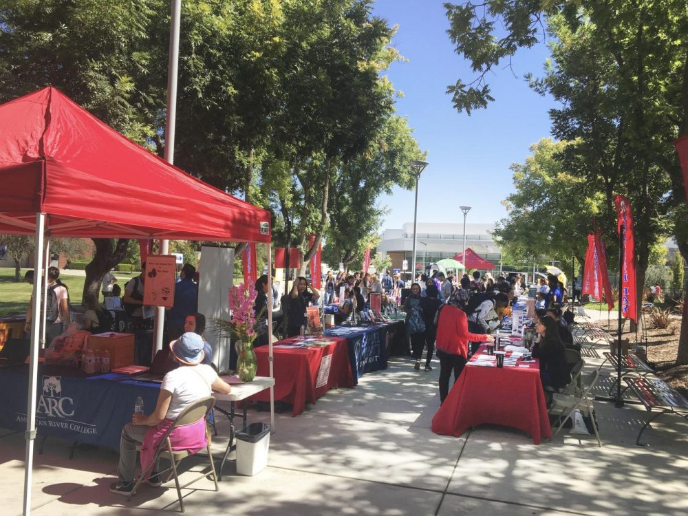 Students attend Transfer Day in the library quad at American River College on Sep. 17 2018. Universities set up booths to talk and supply information for students looking to further their education. (Photo by Hameed Zargry) 