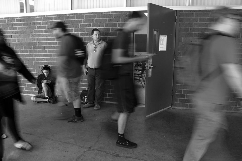 Professor Jason Vitaich waits for his class to begin as students walk around Davies Hall at American River College on Sept. 18, 2018. (Photo Illustration by Ashley Hayes-Stone)