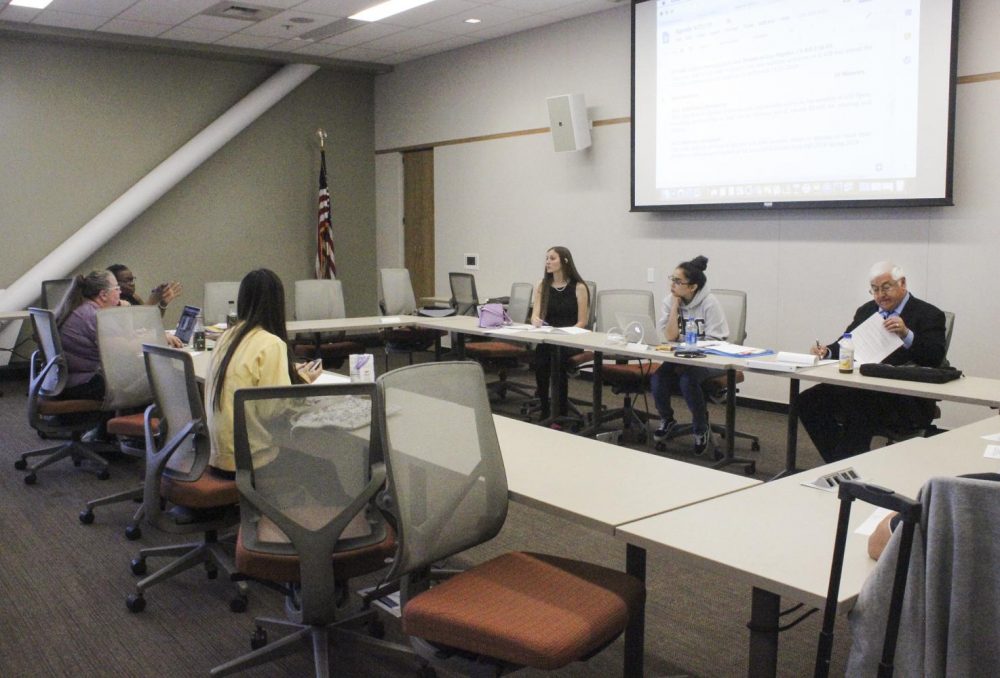 Members of the Associated Student Body Student Senate listen as Advisor Frankie Johnson gives feedback about the resolutions presented during a board meeting at American River College on Sept. 21, 2018. (Photo by Hannah Yates)