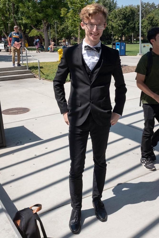 Computer tech major, Jacob McFatter wears a suit and bowtie at American River College for National Bowtie Day on Aug. 28. I saw that it was National Bowtie Day and I thought Why not wear a suit? Cause I mean you need something to look classy with a bowtie, McFatter said. (Photo by Patrick Hyun Wilson)