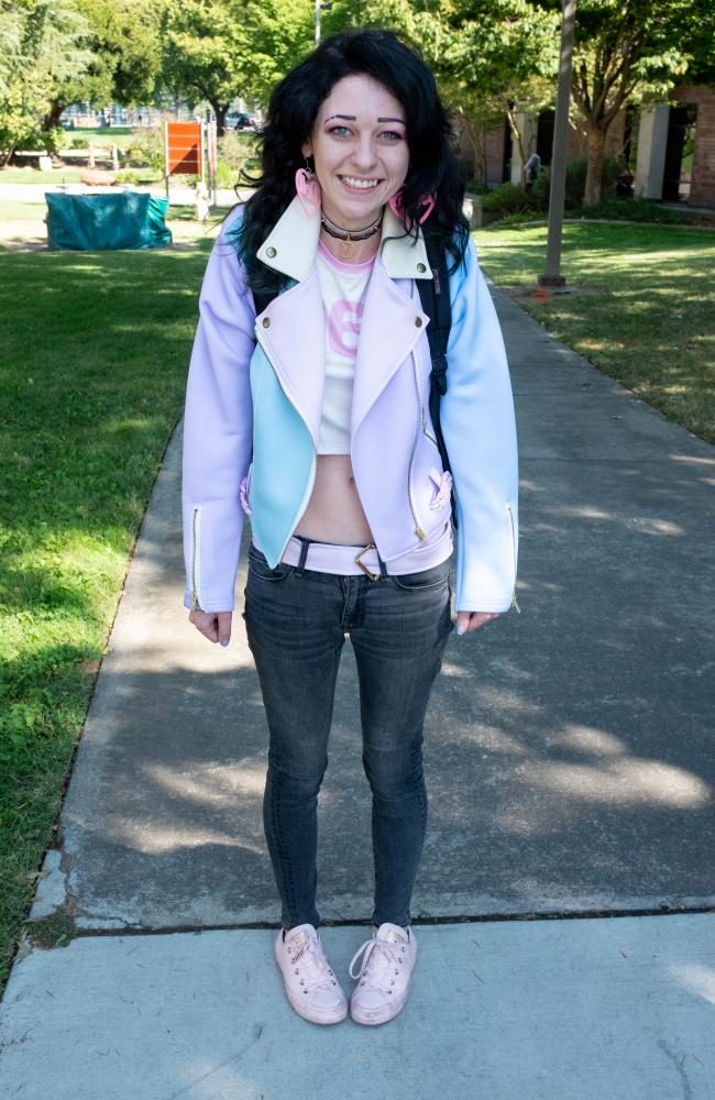 Psychology major, Julia Dimant wears a bright blue and pink jacket and pink shoes with pink earrings at American River College on Aug. 28. I like the unique clothing styles and elegance [in anime] and it kind of stands out to me. Its an inspiration, Dimant said. (Photo by Patrick Hyun Wilson)
