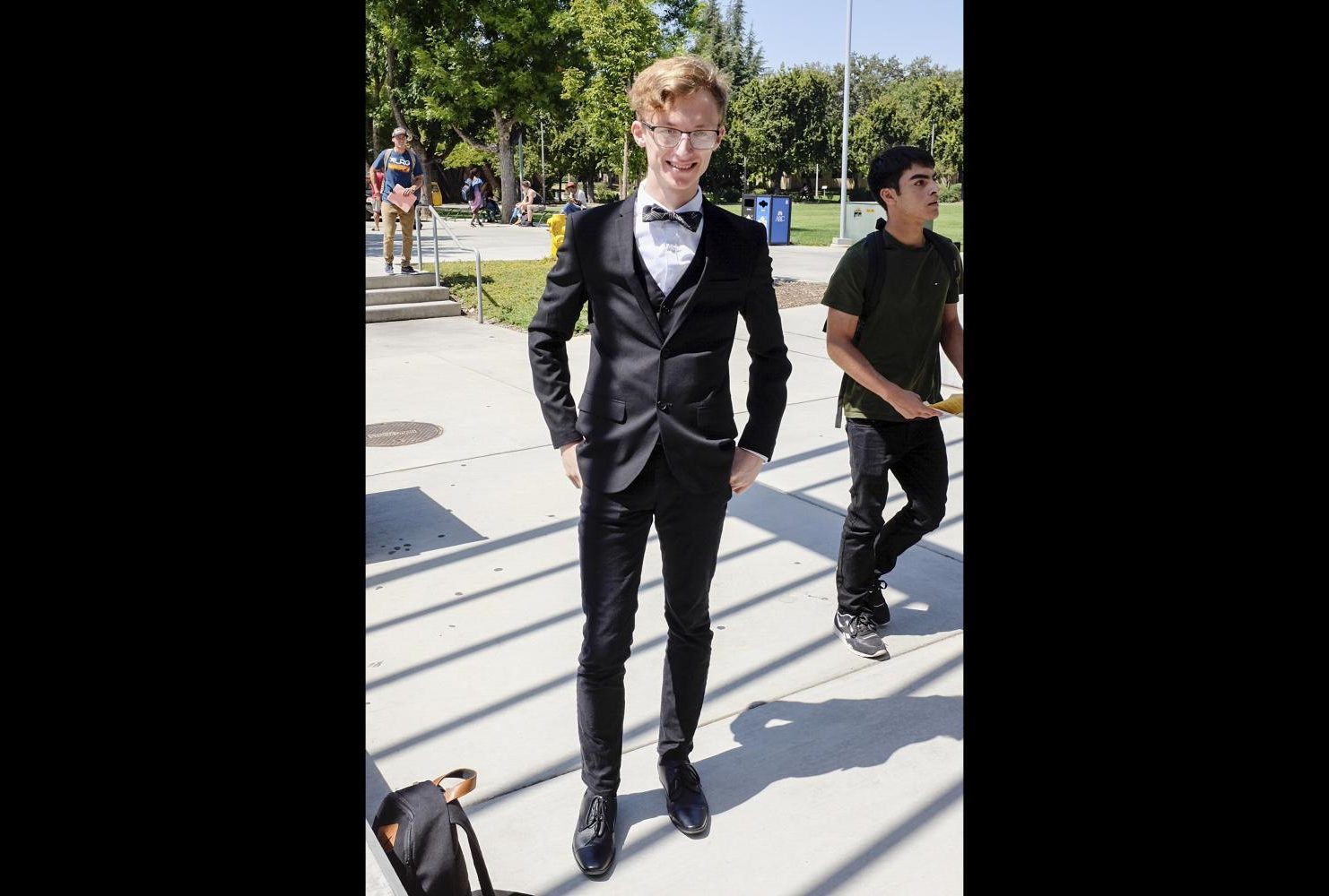 Computer tech major, Jacob McFatter wears a suit and bowtie at American River College for National Bowtie Day on Aug. 28. “I saw that it was National Bowtie Day and I thought ‘Why not wear a suit?’ Cause I mean you need something to look classy with a bowtie,” McFatter said. (Photo by Patrick Hyun Wilson)