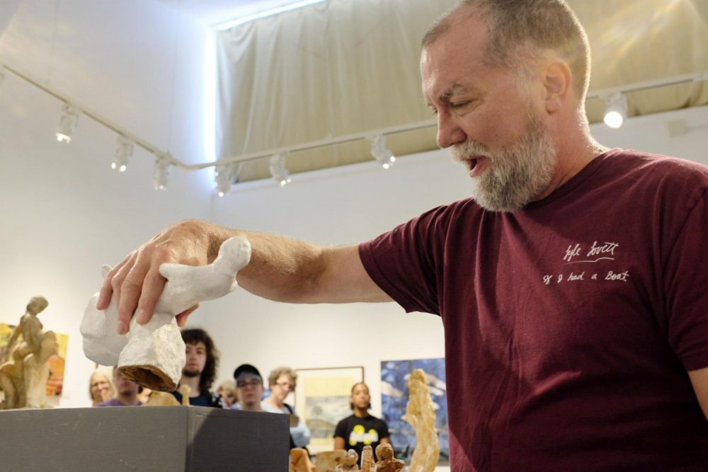 Art Professor Craig Smith speaks at the Kaneko Gallery about the Symbols of Objects  exhibition opening reception on Aug. 30th. (Photo by Patrick Hyun Wilson)