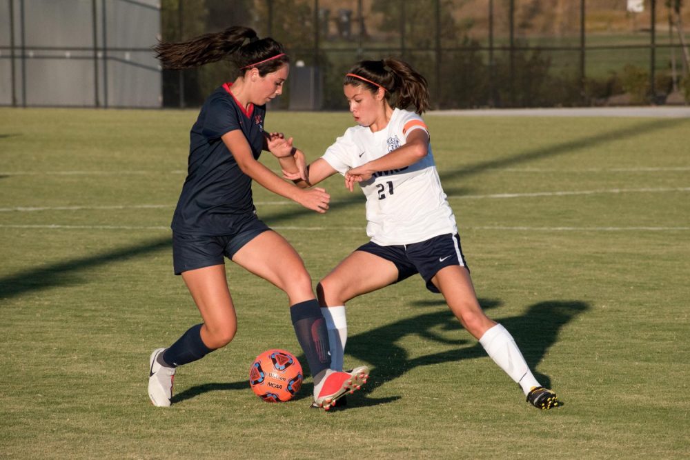 Forward Bianca Avilla faces off against a Cosumnes River College player during the game at American River College on Sept. 21 (Photo by Patrick Hyun Wilson)