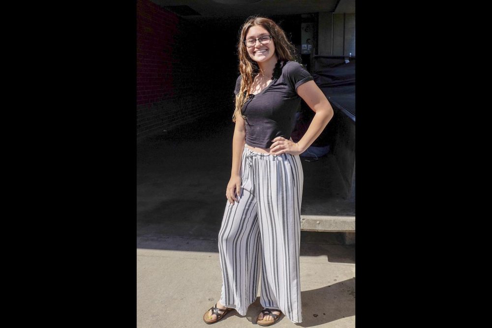 Geography major, Madison Rosen wears loose fitting striped slacks and a black crop top with open toed sandals on Aug. 29. These look like pajamas honestly but theyre cute and comfy... My mom likes to think I dress bohemian kind of, kind of hippie, Rosen said. (Photo by Patrick Hyun Wilson)
