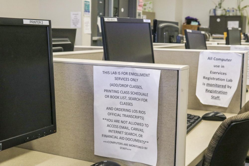 A sign instructing students of the services provided in the computer cubicles in the eServices building at American River College on Sept. 24, 2018. (Photo by Tracy Holmes)