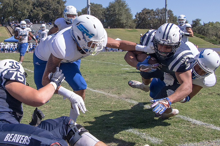 Running back Evyn Holtz is tackled in an attempted rush against the College of San Mateo Bulldogs at Beaver Stadium on Sept. 15. (Photo by Patrick Hyun Wilson)