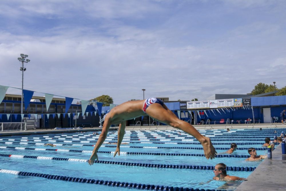 Jacob+Chigbrow+dives+into+the+pool+during+a+water+polo+practice+at+American+River+College+on+Oct.+1%2C+2018.+%28Photo+by+Breawna+Maynard%29