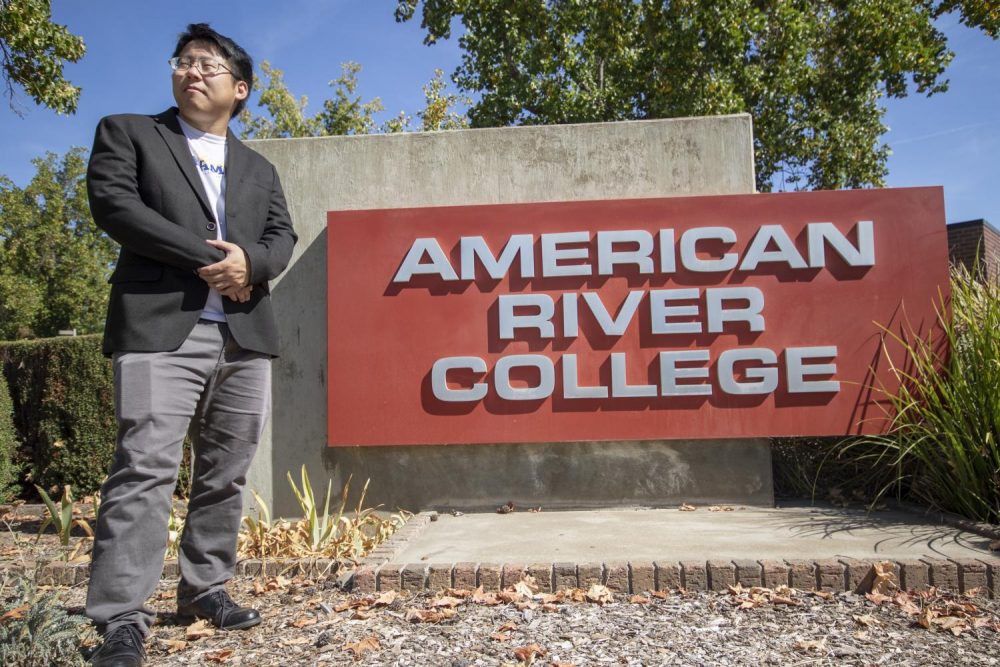 Phillip Kim, who is running for state senate, stands in front of the American River College sign on Sept. 27, 2018. (Photo by Ashley Hayes-Stone)