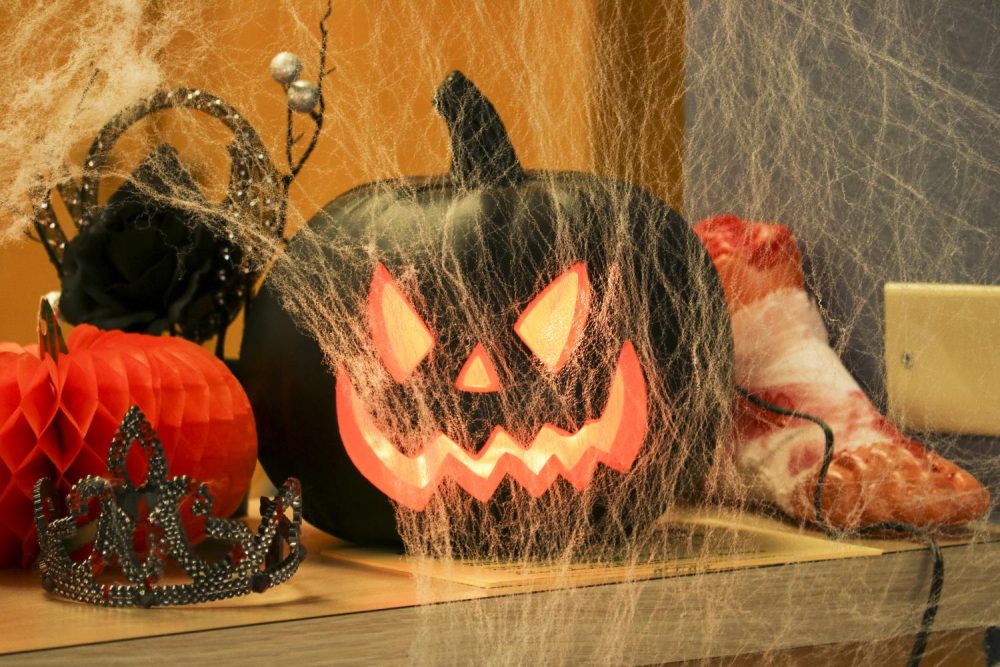 A jack-o-lantern sits on the Enrollment Services desk in the Administration building. (Photo by Gabe Carlos)