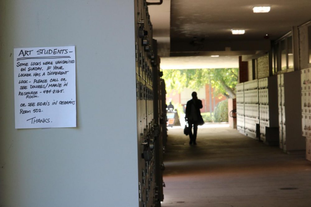 Signs were posted throughout the Fine and Applied Arts Department warning students about the lockers which were vandalized on the weekend of Oct. 12, 2018. (Photo courtesy of Luis Gael Jimenez)