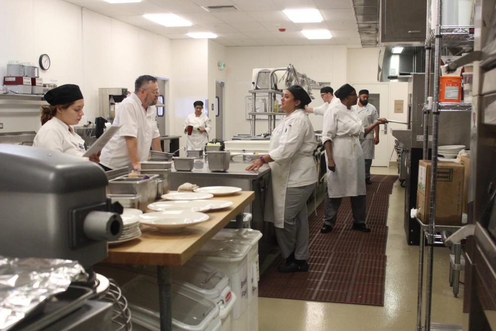 The kitchen and back of the house of the Oak Cafe restaurant on opening day on Sept. 19, 2018. The Oak Cafe restaurant is located inside the culinary arts building at American River College and consists of dozens of students enrolled in the Dining Room and Management class and culinary arts classes who will have real-world experience running a restaurant (Photo by Itzin Alpizar)