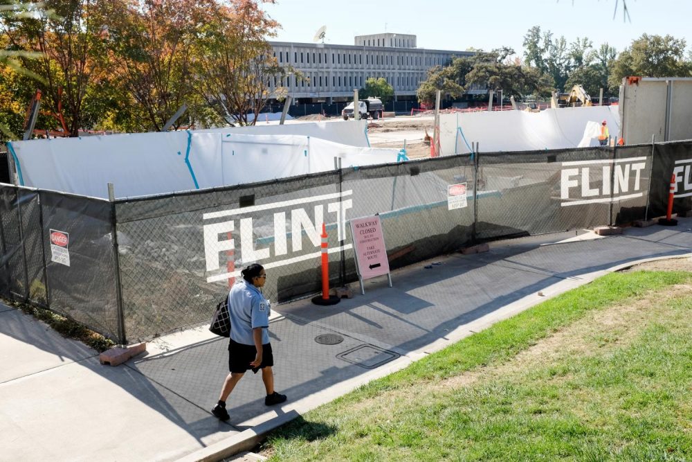 A student walks by the remains of the Liberal Arts building where construction of the new STEM building will take place in 2020, at American River College on Oct. 22, 2018. (Photo by Patrick Hyun Wilson)