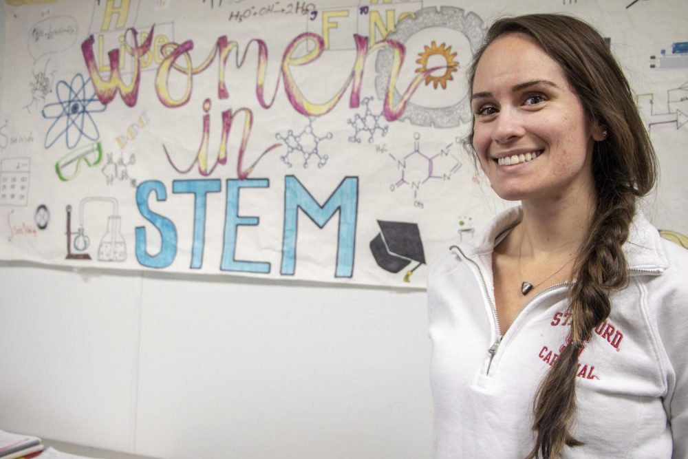 Natasha Skidmore chemistry major and Women in STEM or science, technology, engineering and math, club president, poses in front of the Women in STEM banner in the STEM Center at American River College on Oct. 15, 2018. (Photo by Ashley Hayes-Stone)