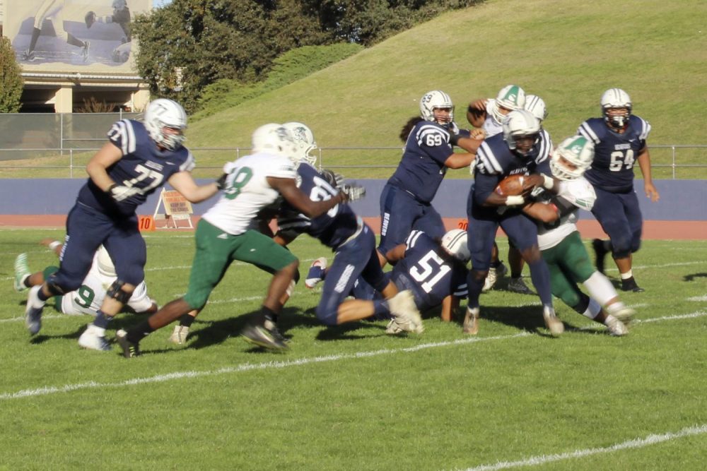 Vonathon Allen, running back for the American River College football team, attempts to rush the ball in the fourth quarter against Shasta at Beaver Stadium on Nov. 3, 2018. (photo by Christian Sutton)