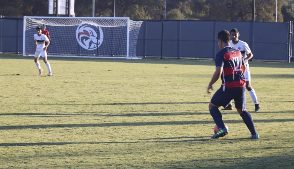 American River freshman, Jeime Reynoso dribbles the ball away from San Joaquin Delta players to be able to make a play for his teammates. ARC ties SJD 0-0. (Photo by Hameed Zargry)