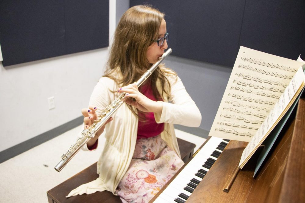 Music major Rebeca Stroup practices playing the flute in one of Music Department’s practice room at American River College on Nov. 13, 2018. (Photo by Ashley Hayes-Stone)