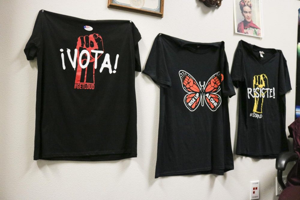 T-shirts+that+read+%E2%80%9CVota%E2%80%9D%2C+%E2%80%9CRise+up+as+One%E2%80%9D+and+%E2%80%9CResist%E2%80%9D+hang+in+the+Puente+counseling+office+in+the+Hub+to+raise+awareness+for+immigrants+rights+and+presence+on+campus+at+American+River+College+on+Nov.+26%2C+2018.+%28Photo+by+Christian+Sutton%29