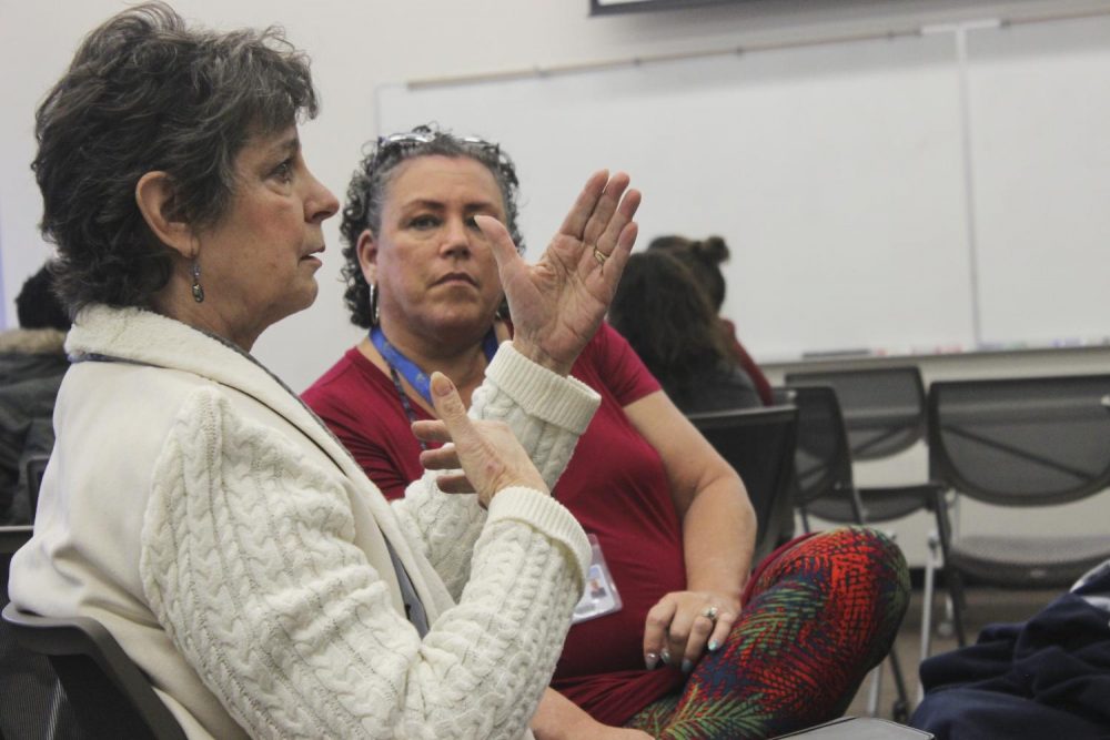 Beth Madigan, Administrator Assistant for the Vice president, (front) and Robin Neal, Vice President of Student Services(back), expressing their thoughts and views on the discussion at the hate and bias workshop Dec. 3, 2018 (Photo by Breawna Maynard)