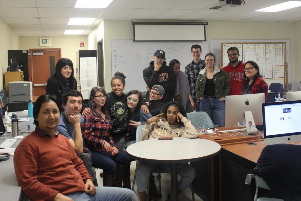 The Current staff and advisor, Rachel Leibrock, gather together on the last day of class instruction of the fall semester on Dec. 13, 2018. (Photo by Alexis Warren)