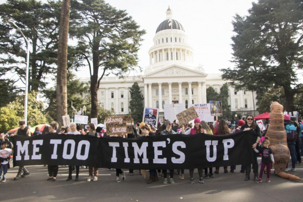 Demostrators hold up a banner that reads Me Too Times Up in front of the California State Capitol during the third annual Womens March in Sacramento, Calif. on Jan. 19, 2019. The number of attendance decrease from last years event according to Sacramento Police 10,000 individuals participated in the march than the  estimasted 36,000 marchers that attended last year.