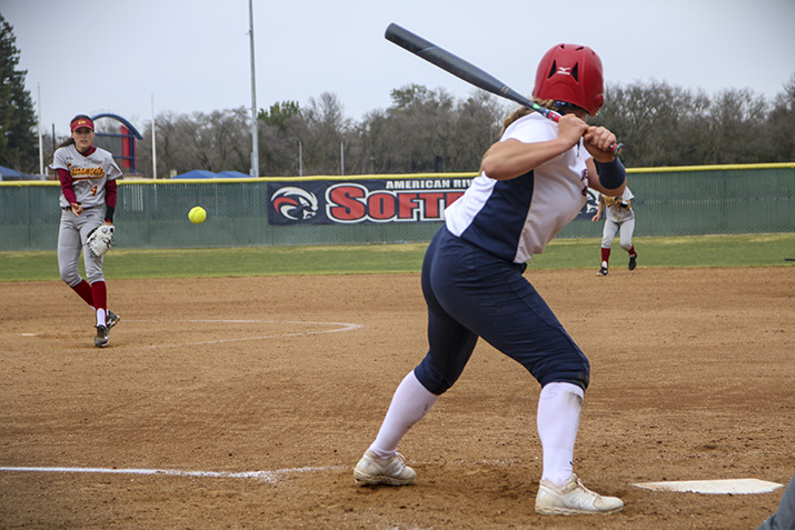 American River College softball player Victoria Bojorques bats against Sacramento City pitcher Danielle Reyes at the game on Feb. 23, 2019 at ARC. Sac City beat ARC twice that day. (Photo by Emily Mello)