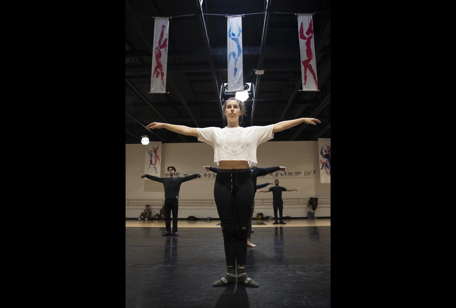 Cat Vandervan, teaching assistant, leads warm ups in the American River College dance studio during Dance Production: Studio & Stage, on Feb. 6, 2019. (Photo by Ashely Hayes-Stone)