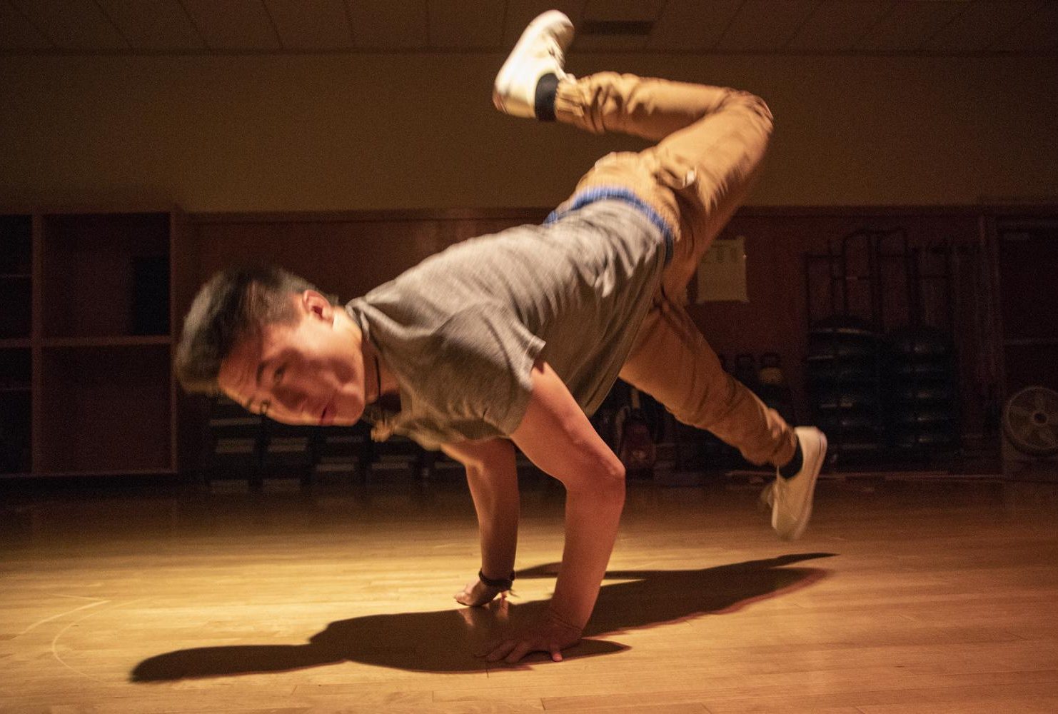 Dance major, Jeremy Xiong break-dances in a dance studio at American River College during the Dance Production: Studio and Stage class, on Feb. 6, 2019. He describes himself as a b-boy. (Photo by Ashley Hayes-Stone)