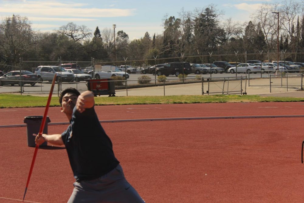 American River College student Davis Yasuda throws a javelin during practice on the football field at ARC on Feb. 20, 2019.(Photo by Anthony Barnes)