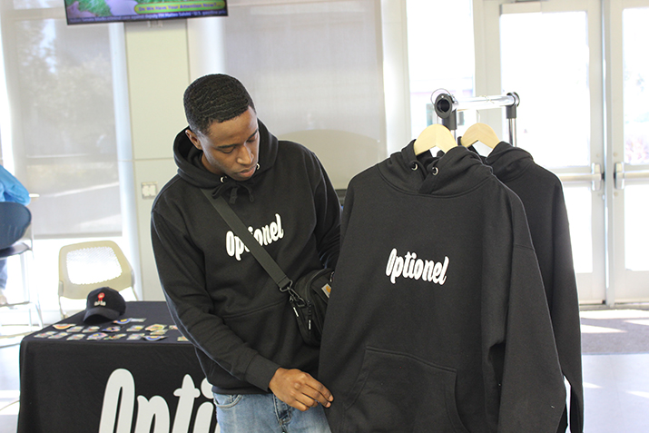 Former American River College student Austin Herell showcases his own clothing line named Optionel, in the student center on Feb. 19, 2019. (Photo by Breawna Maynard)