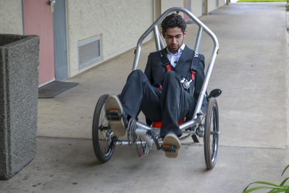 Jesbaam Sanchez, a mechanical engineering major and secretary of the engineering club, test drives one of the vehicles they will be entering in the contest, on March 1 at American River College. (Photo by Hameed Zargry)