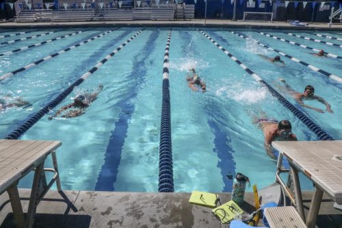 Mens and womens swim team practice in the sun, accompanied by music at American River Colleges pool on March 11, 2019. (Photo by Irene Jacobs) 