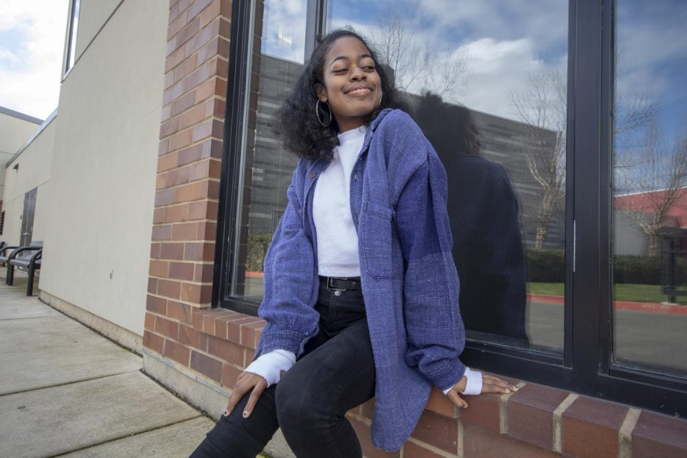 Opinion editor Imani Smith depends on thrifted items for a majority of her wardrobe. Thrifting clothing is a great way for college students to save money, while still looking trendy. (Photo illustration by Ashley Hayes-Stone)