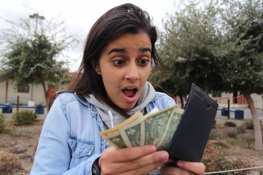 Staff writer Emily Mello is excited about the extra money she has in her wallet because of the American River College Promise Grant on March 3, 2019. (Photo by Katia Esguerra)