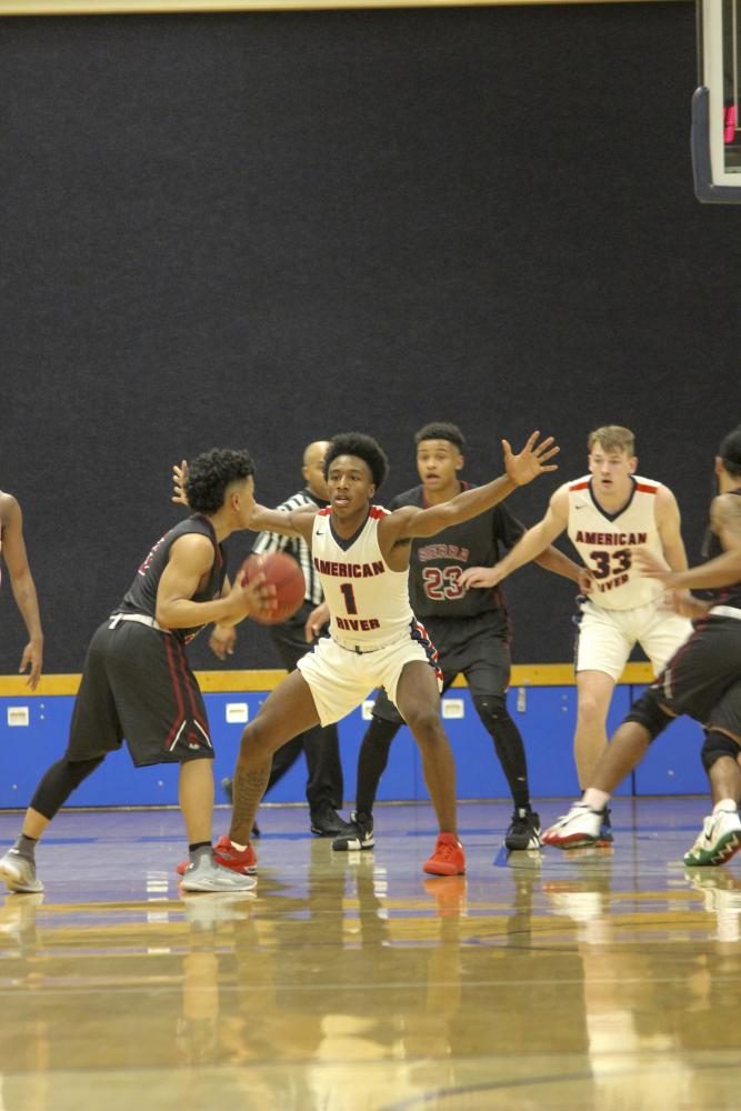 American River College guard, Kareem Clark, defends another player against the Sierra College basketball team on Feb 28, at American River College. (Photo by Breawna Maynard)