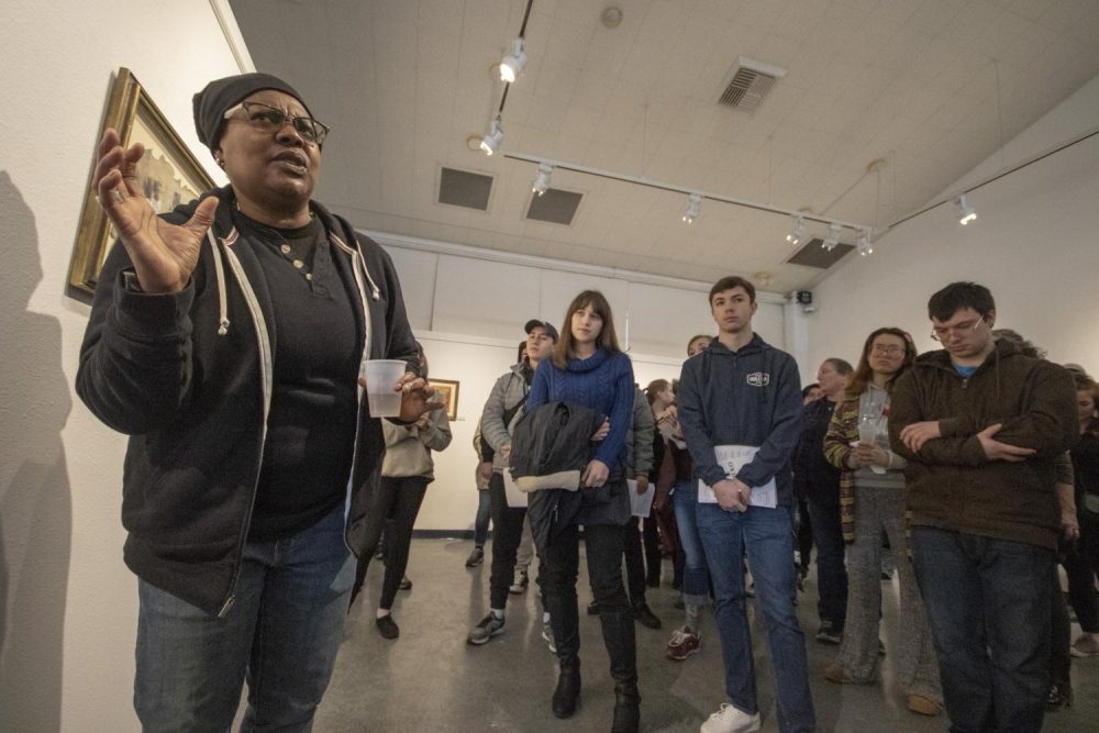 Laney College art professor Fan Lee Warren speaks about her art show, “Piece$” which features her highly symbolic work in the James Kaneko Gallery at American River College on Feb. 28, 2019. (Photo by Ashley Hayes-Stone)