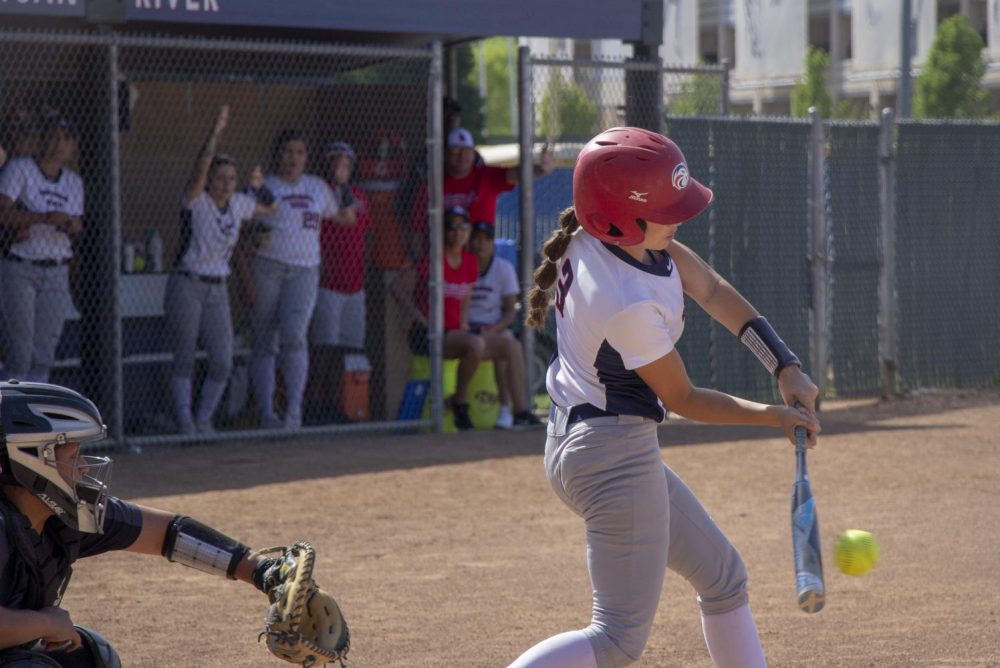 American River College second basemen Elena Avila hits a single in the bottom of the sixth inning against San Joaquin Delta College. (Phot by Emily Mello) 