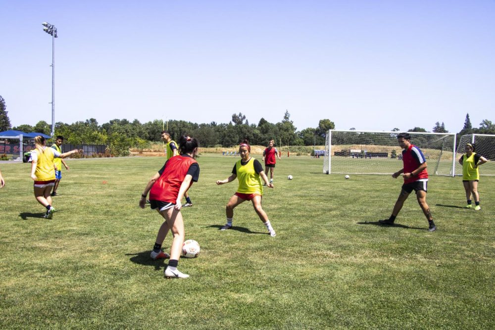 Students practice soccer drills on the American River Collge soccer field during their off season on April 29, 2019. (photo by Katia Esguerra)