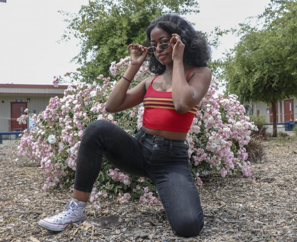 Opinion editor Imani Smith sports the current microglasses trend. It’s important to have your own sense of style without being influenced by what others find fashionable. (Photo illustration by Irene Jacobs)