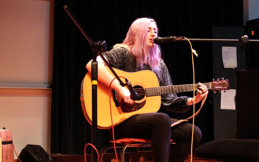 American River College music student Riddle Anne performs an original song for the ARC Acoustic Cafe on March 1, 2019. (photo by Ariel Caspar)