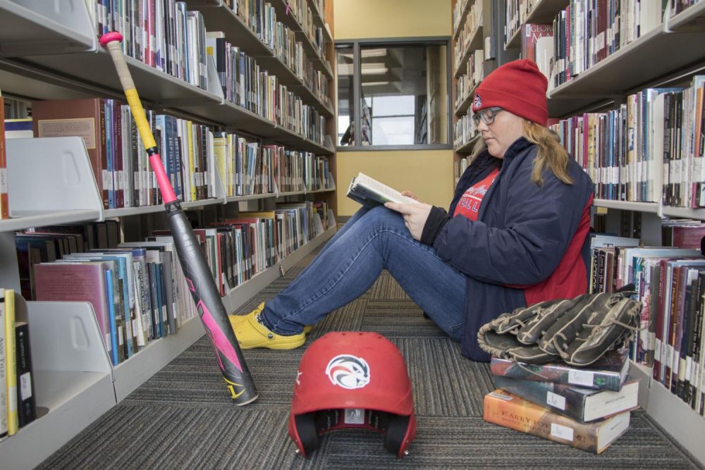 American River College softball player Celine Castonguay uses the campus library as a second home to study in between classes and her softball practices. (Photo by Ashley Hayes-Stone)