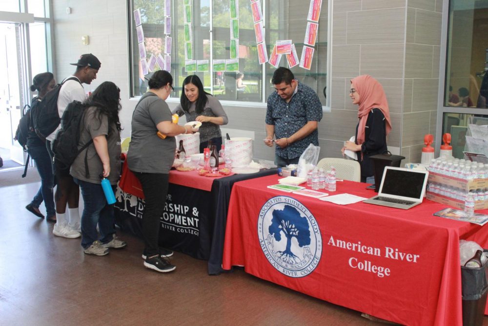 To kick off the new semester and promote their organization, the American River College Associated Student Body hands out free ice cream sundaes to students in the Student Center at ARC on Aug. 27, 2019.  (Photo by Thomas Cathey)