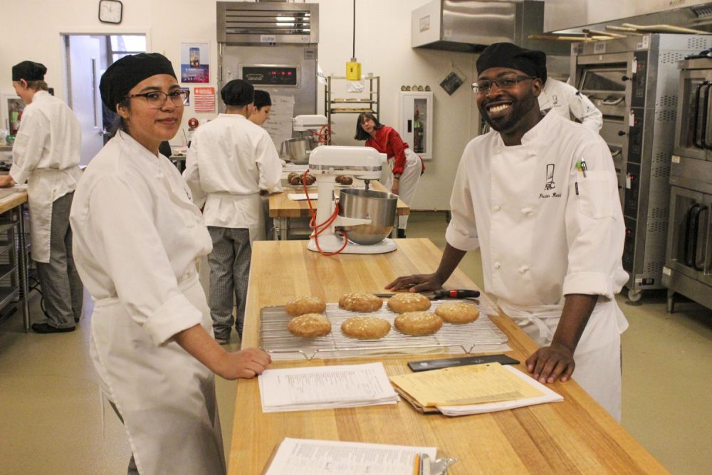 Culinary majors Andrea Valdez and Preston Reid prepare multigrain rolls for sandwiches for the Oak Cafe in Hospitality Management 320, Beginning Baking class taught by Judy Parks at American River College on Sept. 18, 2019. Today is the semester opening of the student run Oak Cafe and all proceeds go back to the Culinary Department. (Photo by Oden Taylor)