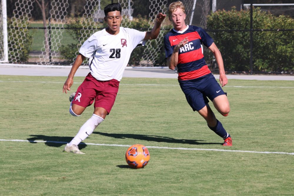 De Anza College forward Douglas Stone defends the ball against American River College forward Kyle Prusia during a match at ARC home soccer stadium on Sept. 06, 2019.(Photo by Emily Mello) 
